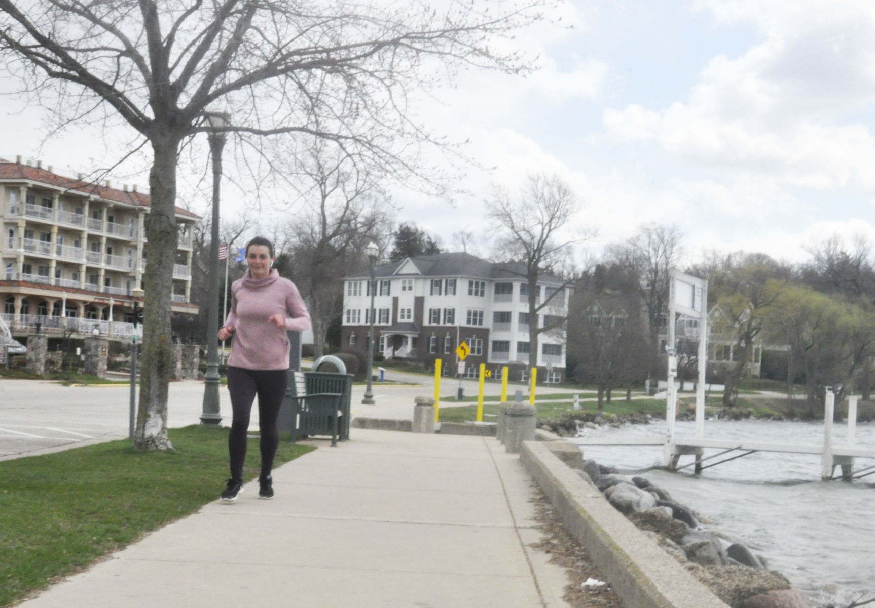 Jogger on the lake shore path in Lake Geneva